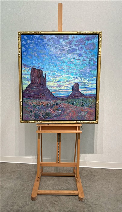 Anyone who has seen a sunset over Monument Valley will never forget it.  As the world slowly darkens and the landscape hushes, the sky celebrates the closing of another day with brilliant hues and cloud formations.  This painting captures that transient moment in time with thick, impasto brush strokes and expressionistic color.</p><p>This painting was done on 1-1/2" canvas, with the painting continued around the edges.  It has been framed in a gilded and hand-carved floater frame.</p><p>--- </p><p>Monument Valley<br/><B>F U N F A C T S</B></p><p>Formed during the Permian period (50 million years before dinosaurs roamed the earth), this patch of land once formed part of a seafloor where sediments and sandstone piled up in layers for millions of years. The Valley is now a sacred place for the Navajo, whose mythology holds that these grand spires contain the spirits of Najavo warriors. Monument Valley is found on the Navajo National Reservation. </p><p>The Valley is also one of the most filmed spots in the history of filmmaking. The valley was hailed "John Wayne country" for appearing in no less than five of his movies. It also served as a backdrop for an iconic scene in Forest Gump. </p><p>"There are certain places in the world that seem like special effects, they don't seem real," said film historian Scott Eyman. "They're too perfect. And the first time you come here, you see it through John Ford's eyes." (Ford is widely regarded as one of the most important and influential film-makers in history.)</p><p>--</p><p>This painting was a part of the <a href="https://www.erinhanson.com/Event/redrock2018" target=_blank"><i>The Red Rock Show</i></a> in San Diego in 2018.  <a href="https://www.erinhanson.com/Portfolio?col=The_Red_Rock_Show_2018" target="_blank"><u>Click here</u></a> to view the other Red Rock paintings.<br/>