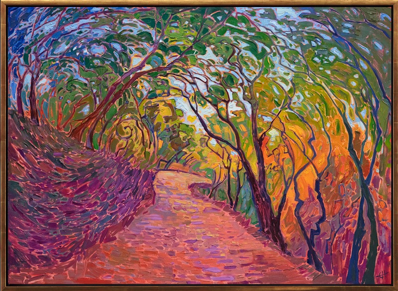 Rainbow hues of autumn catch the early morning light. This painting was inspired by driving through the oak-lined roads of Paso Robles wine country. The brush strokes are loose and expressive, capturing the movement and color of the scene.</p><p>"Wooded Path" was created on 1-1/2" canvas, with the painting continued around the edges. The painting arrives framed in a contemporary gold floater frame.