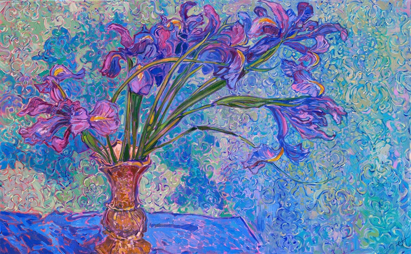 A vase of purple irises stands against damask wallpaper, the richly colored blooms blending and contrasting with the background. Thick brushstrokes of oil paint capture the transient beauty of the flowers with expressive joy and movement.

Erin Hanson, creator of the style Open Impressionism, mixes her color palette from only five colors, using her palette to pre-blend the entire array of colors that will appear in the painting before ever picking up a brush. When she paints, she lays her strokes side by side without layering, creating a mosaic of color and texture across her canvas. Her unmuddied colors are bright and vibrant, capturing the imagination.