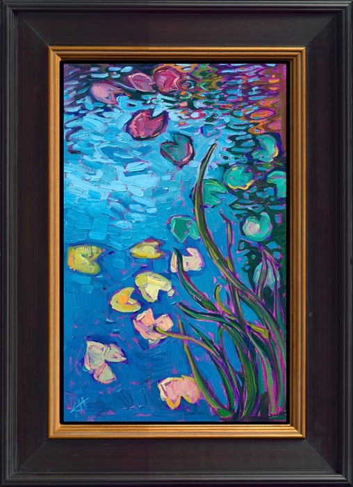 The calm, still waters of Monet's lily pond reflect a blue sky above. The water lilies appear in hues of pink, green, and yellow. Thickly applied brushstrokes placed side by side without layering capture the scene with expressive color.